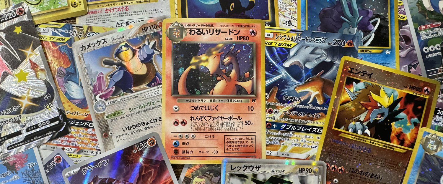 Collection de cartes Pokémon japonaises étalées, dont Dracaufeu obscur et Entei